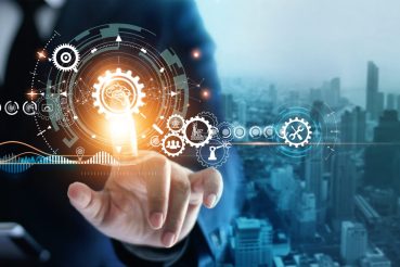 Industry 4.0, Businessman touching brain in cogwheel, Innovative and futuristic, Business process workflow development and optimisation of construction industrial on city background. Industry 4.0, Businessman touching brain in cogwheel, Innovative and futuristic, Business process workflow development and optimisation of construction industrial on city background.